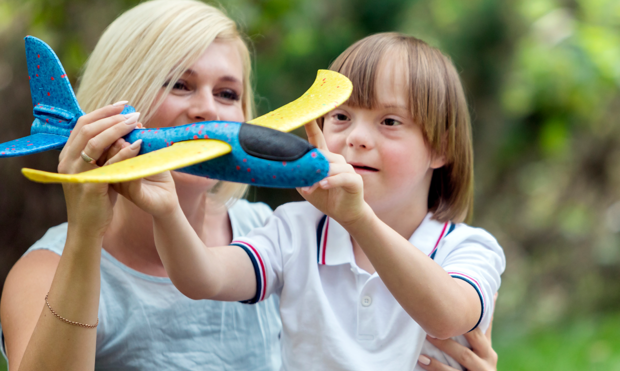 Parent and child playing with toys