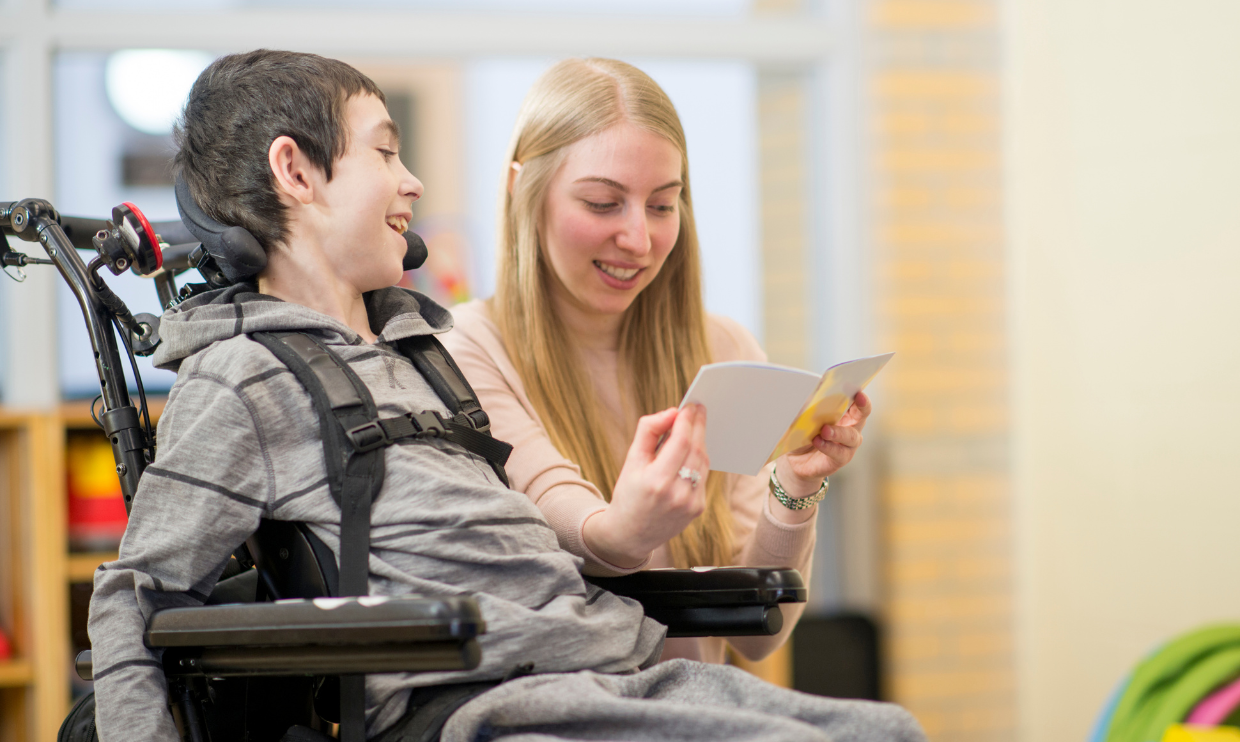 Aide helping a student in school