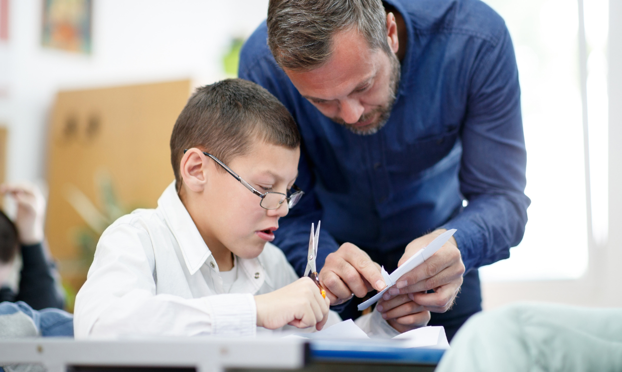 Teacher helping student