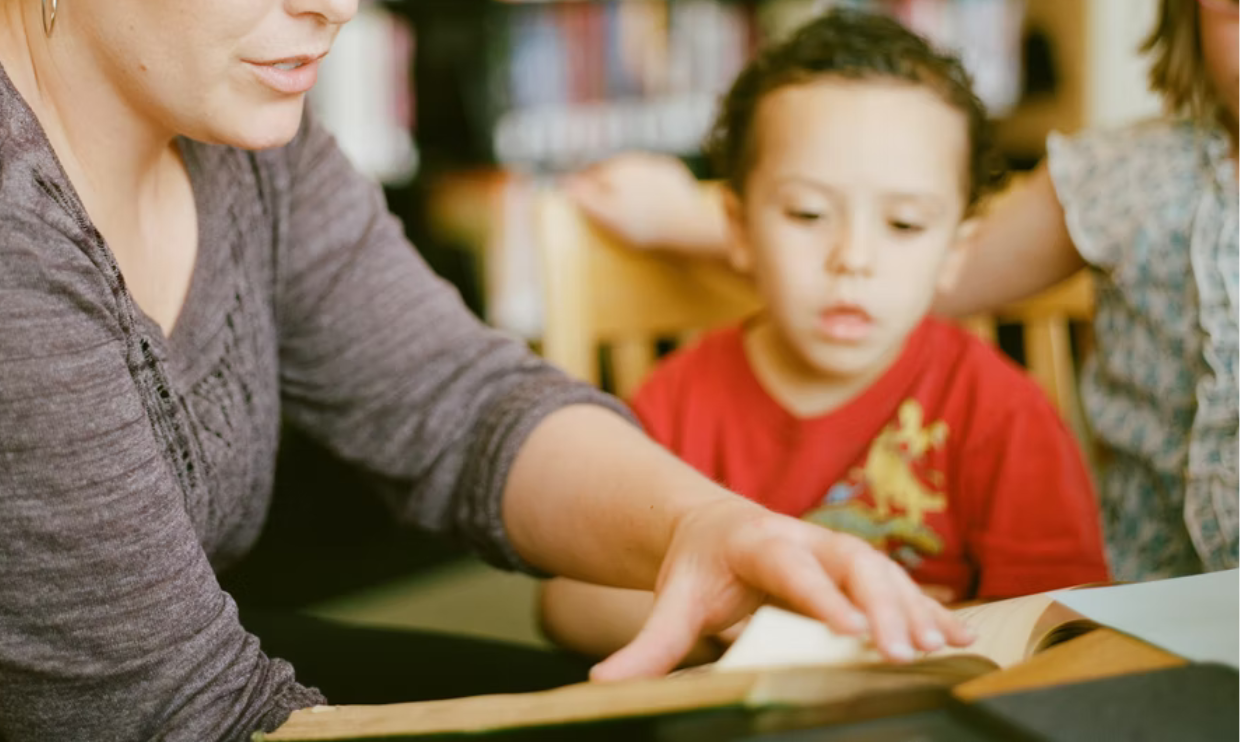 Parent and child reading book