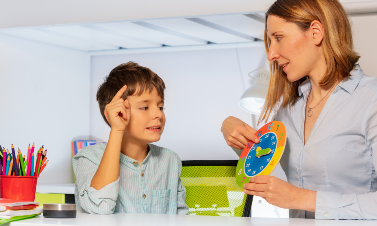 Child working on school skills with their teacher