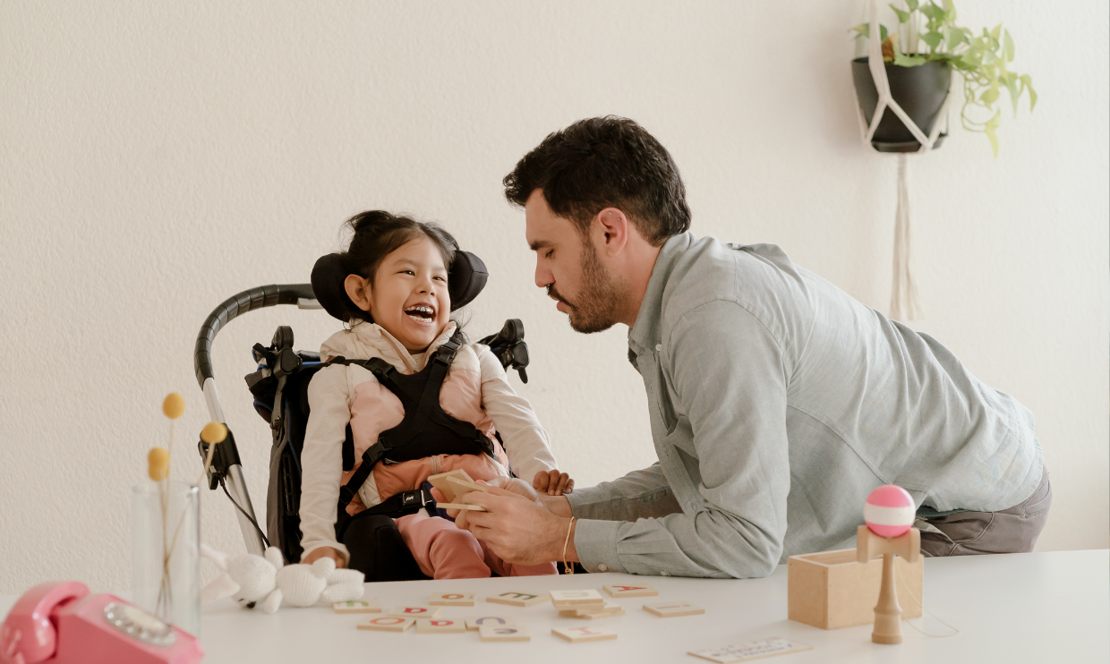 Adult helping a child with disability